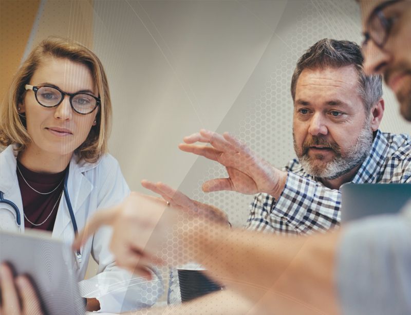 Colleagues talking around a table