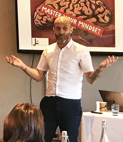 John Lewis speaking at a Master Your Mindset talk
